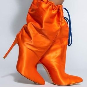 Stylish orange drawstring boots